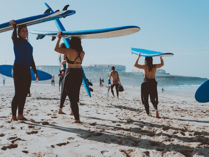 group of surfing stundents ready